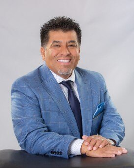 Dr. Johnny Garcia, Founder and CEO of SimIS, professional headshot.
